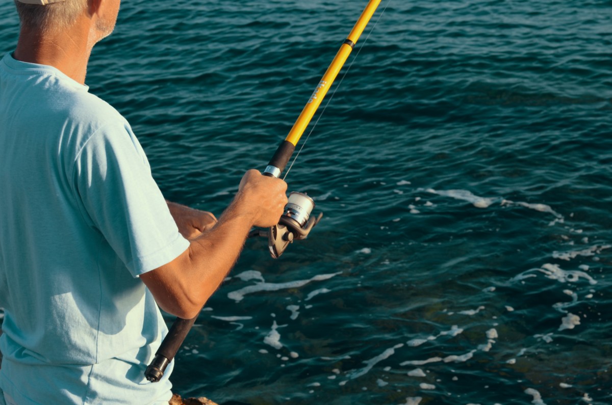 Man holding a fishing rod