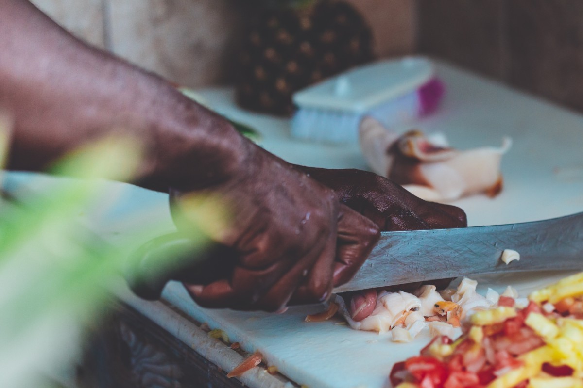 Man chopping food