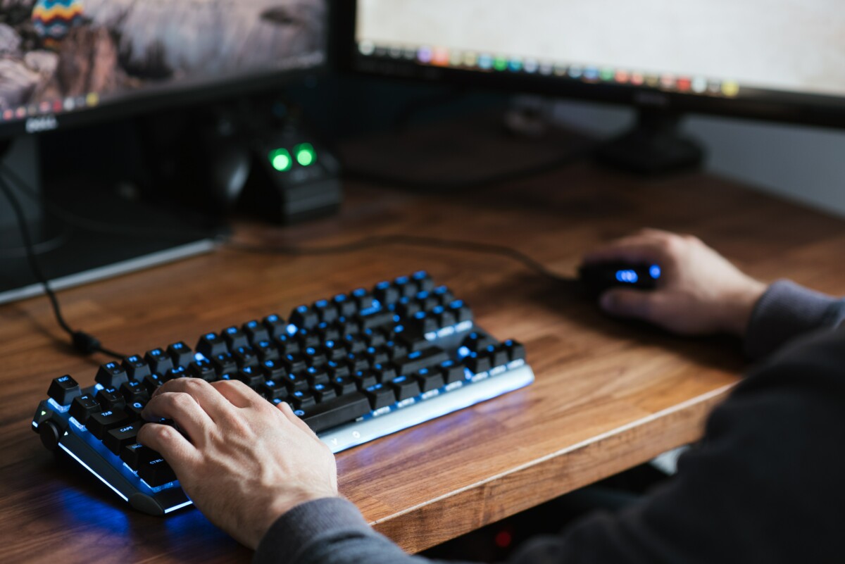 person using a keyboard and mouse