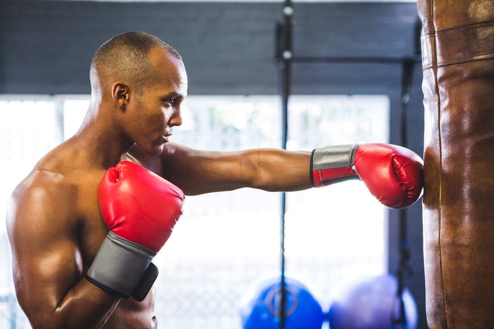 Boxer experiencing wrist pain after an injury during training or a boxing session